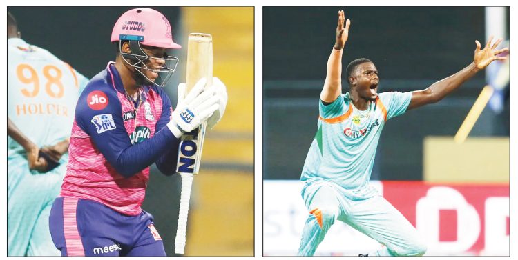 Shimron Hetmyer, left, got the better of his West Indian teammate Jason Holder yesterday hitting the bowler for 18 runs in one over as Hetmyer’s Rajasthan Royals defeated Holder’s Lucknow Super Giants by three runs to climb to the top of the Indian Premier League standings.