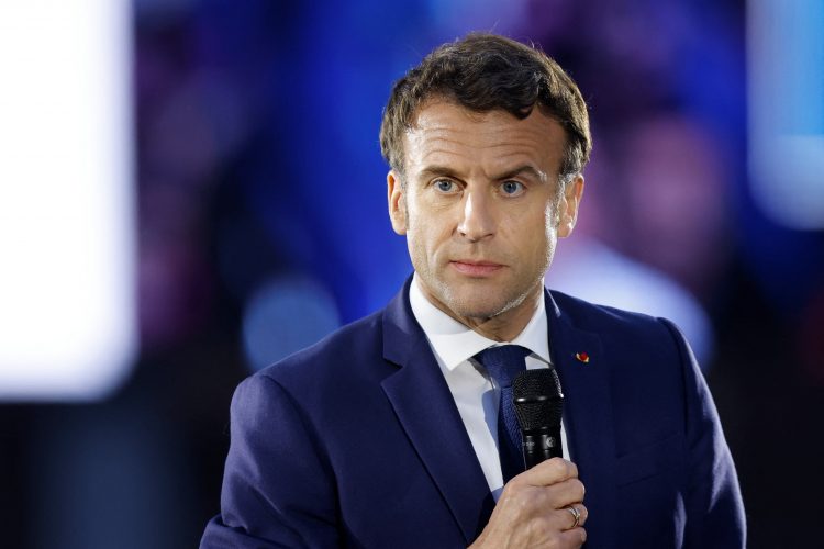 French President Emmanuel Macron, candidate for re-election in the 2022 French presidential election, delivers a speech during a campaign meeting at the Place du Chateau near the Cathedral in Strasbourg, France April 12, 2022. REUTERS/Johanna Geron