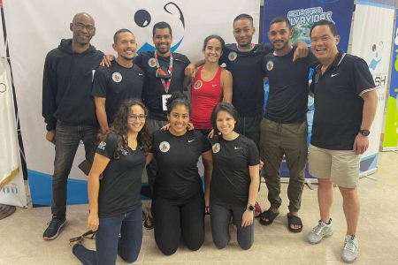 Nicolette Fernandes and the Guyana team following her gold medal triumph Wednesday evening (Photo courtesy of the Guyana Squash Association) 