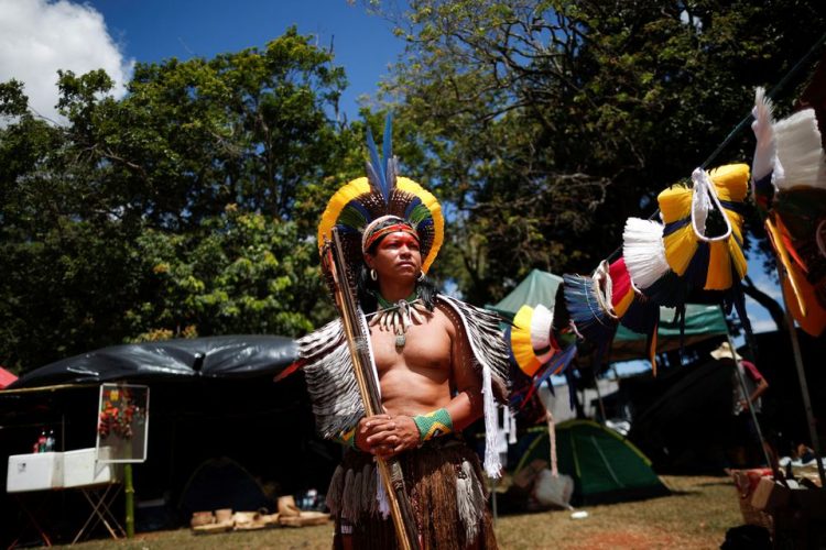 Indigenous Ubiranan Pataxo poses for a picture at the Terra Livre (Free Land) camp, a protest-camp to defend indigenous land and cultural rights that they say are threatened by the right-wing government of Brazil's President Jair Bolsonaro, in Brasilia, Brazil April 4, 2022. REUTERS/Adriano Machado