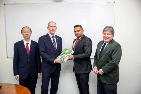 Minister of Natural Resources Vickram Bharrat (second from right) and ExxonMobil Guyana President Alistair Routledge (second from left) with the licence. (Ministry of Natural Resources photo)