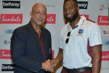 CWI President Ricky Skerritt and Kieron Pollard.
