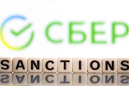 Plastic letters arranged to read "Sanctions" are placed in front of Sberbank bank logo in this illustration taken, Bosnia and Herzegovina, February 25, 2022. REUTERS/Dado Ruvic/Illustration