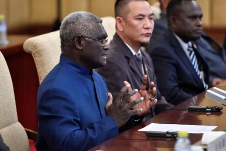 Solomon Islands Prime Minister Manasseh Sogavare talks to Chinese President Xi Jinping (not pictured) during their meeting at the Diaoyutai State Guesthouse in Beijing, China, October 9, 2019. Parker Song/Pool via REUTERS