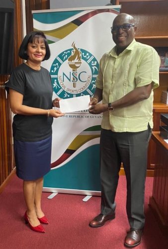Director of Sport, Steve Ninvalle (right), presenting the NSC’s $1.6M cheque to GBA Secretary, Emily Ramdhani.
