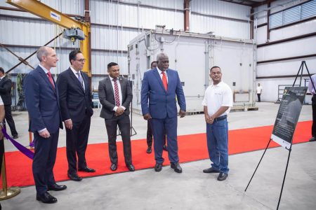 Prime Minister Mark Phillips (second from right) being given a tour of the facility. (Office of the Prime Minister photo)