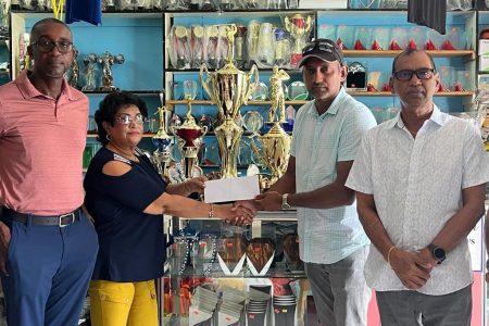 Veronica Dhanraj hands over the sponsorship cheque to LGC Treasurer, Maxim `Danny’ Mangra. To his left is Ramesh Sunich and LGC Secretary, Chet Bowling. LGC vice president Paton George is to the right of Dhanraj.