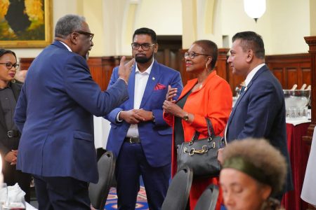 President Irfaan Ali (centre) listening to Sir Clive Lloyd (second from left).  Also in photo from left are Minister of Tourism, Industry and Commerce, Oneidge Walrond, Baroness Valerie Amos and CEO of G-Invest, Dr Peter Ramsaroop. (Office of the President photo) 