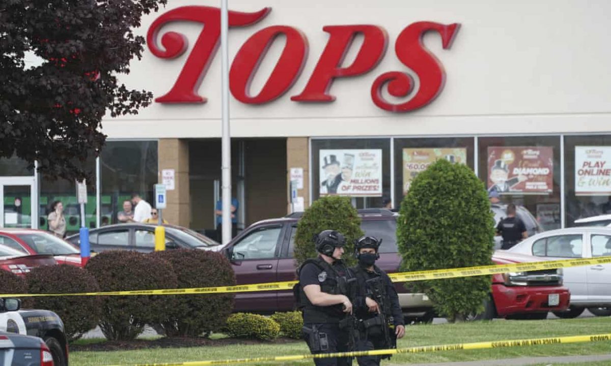 Police secure an area around a supermarket where at least 10 people were killed in a shooting. Photograph: Derek Gee/AP