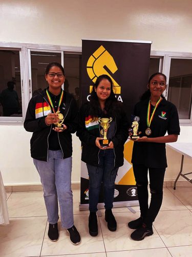 Three champions! From left Pooja Lam, Sasha Shariff and Jessica Callender, the future of Guyana’s women’s chess. They all excelled at the GAICO Grand Prix 2 at the National Stadium, Providence, last week.
