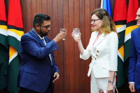 President Irfaan Ali (left) and Czech Republic Ambassador, Sandra Lang Linkensederova sharing a toast (Office of the President photo)