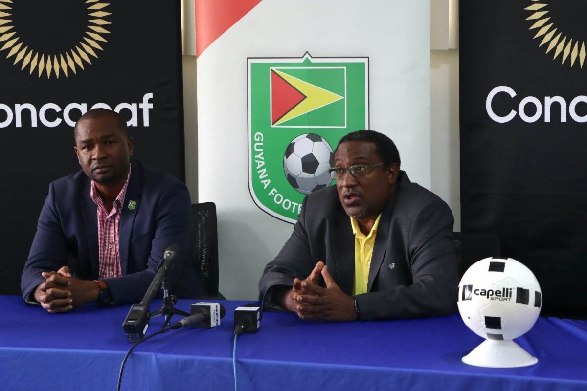 GFF President Wayne Forde (left) and Golden Jaguars Head Coach Jamaal Shabazz disclosing the national team provisional roster for the 2022 CONCACAF Nations League yesterday