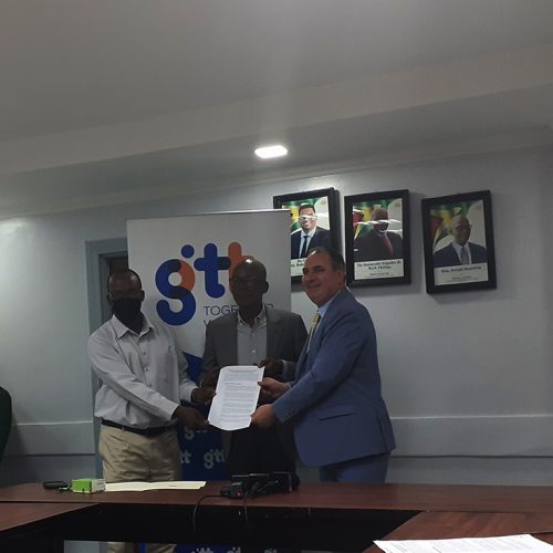 From left are GPTWU President Harold Shepherd, Minister of Labour Joseph Hamilton and CEO of GTT Damian Blackburn with the newly signed MoU 