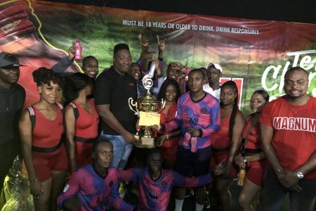 Captain of Back Circle Stephon McLean receiving the championship from Magnum Brand Manager Jamal Baird while teammates, tournament officials, and brand representatives look on