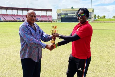 Player of the Match, Tremayne Smartt receives her award from Omar Bacchus
