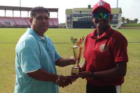 Shabika Gajnabi who made 129 runs and took three wickets receives her player of the match award from national selector, Peter Persaud