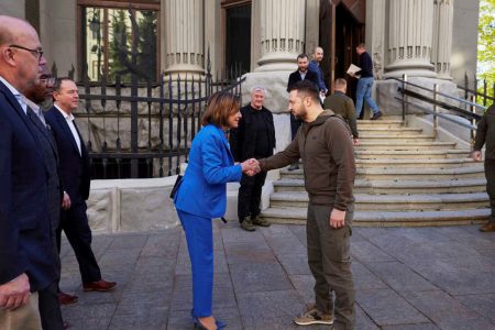 In this image released by the Ukrainian Presidential Press Office on Sunday, Ukrainian President Volodymyr Zelenskyy and U.S. Speaker of the House Nancy Pelosi shake hands in Kyiv on Saturday. AP