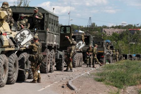 A convoy of pro-Russian troops is seen before the expected evacuation of wounded Ukrainian soldiers from the besieged Azovstal steel mill in the course of Ukraine-Russia conflict in Mariupol, Ukraine, May 16, 2022.
(photo credit: REUTERS/ALEXANDER ERMOCHENKO)