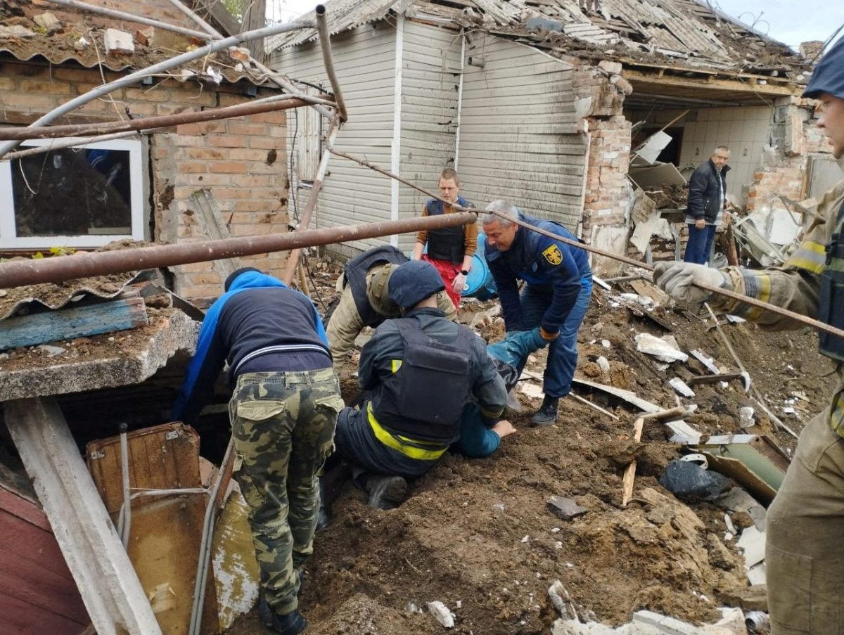 Police officers help rescue people from the rubble after an air strike, during Russia’s invasion of Ukraine, in Bakhmut, Donetsk Region, Ukraine, in this handout picture released May 19, 2022 State Emergency Service of Ukraine/Handout via REUTERS 