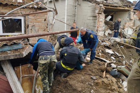 Police officers help rescue people from the rubble after an air strike, during Russia's invasion of Ukraine, in Bakhmut, Donetsk Region, Ukraine, in this handout picture released May 19, 2022 State Emergency Service of Ukraine/Handout via REUTERS 
