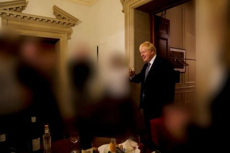 British Prime Minister Boris Johnson gestures in 10 Downing Street during gathering on the departure of a special adviser, in London, Britain November 13, 2020 in this picture obtained from civil servant Sue Gray's report published on May 25, 2022. Sue Gray Report / gov.uk/Handout via REUTERS