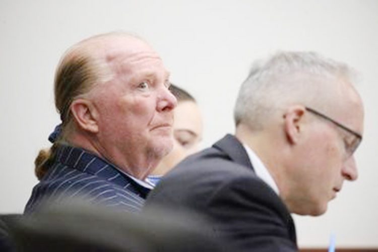 Celebrity chef Mario Batali listens during the second day of his trial on a criminal charge that he forcibly groped and kissed a woman at a restaurant in 2017, at Boston Municipal Court, in Boston, Massachusetts, U.S., May 10, 2022. Stuart Cahill/Pool via REUTERS