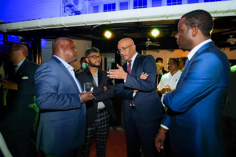 Vice-President Bharrat Jagdeo (second from right) and Opposition Leader Aubrey Norton (fourth from right) in discussion at the Europe Day observance hosted by the European Union at the Georgetown Club yesterday. Also in this photo are Minister of Foreign Affairs Hugh Todd (right) and Georgetown Mayor Ubraj Narine (third from right) (Photo from Vice-President Bharrat Jagdeo’s Facebook page)