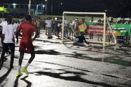 Gold is Money goalkeeper Romel Legall concedes from the penalty spot against Showstoppers during their quarterfinal clash in the Magnum Independence Cup at the National Park Tarmac