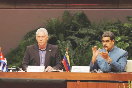 Cuba’’s President Miguel Diaz-Canel delivers a speech as Venezuela’s Presi-dent Nicolas Maduro reacts during the ALBA group meeting in Havana, Cuba, May 27, 2022. REUTERS/Alexandre Meneghini