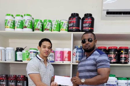Recently, owner of Guyana’s leading gym equipment and supplement supplier, Jamie McDonald, presented a sponsorship cheque to Organizing Secretary of the GBBFFI, Videsh Sookram.