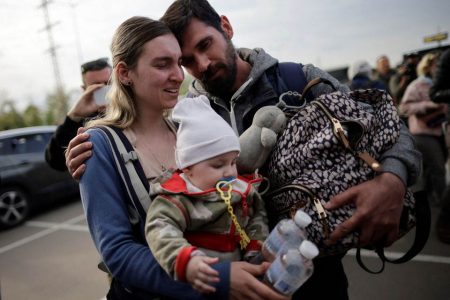 A family of Ukrainian evacuees from Mariupol embraces after arriving at a registration centre for internally displaced people, amid Russia's invasion of Ukraine, in Zaporizhzhia, Ukraine May 3, 2022. REUTERS/Ueslei Marcelino