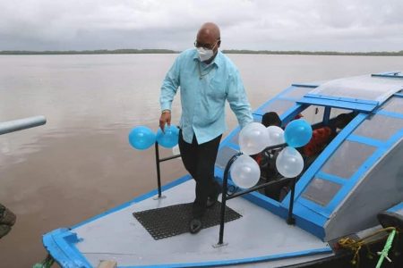 Public Works Minister Juan Edghill disembarking one of the boats (Ministry of Public Works photo)
