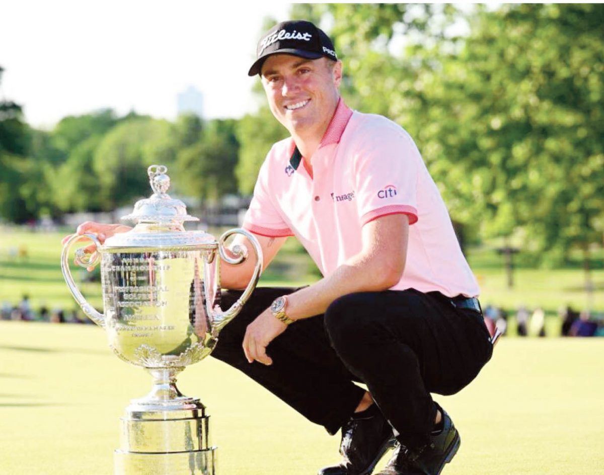 Justin Thomas with the trophy