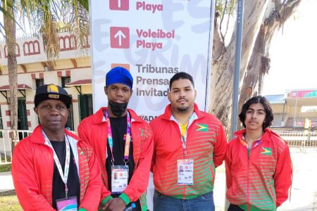 Coaches Sebert Blake (left) and Jonathan Mangra (second from right), pose with their charges, boxer, Travis Inverary (second from left) and Matthew Beharry after touching down in Argentina for the third edition of the South American Youth Games.