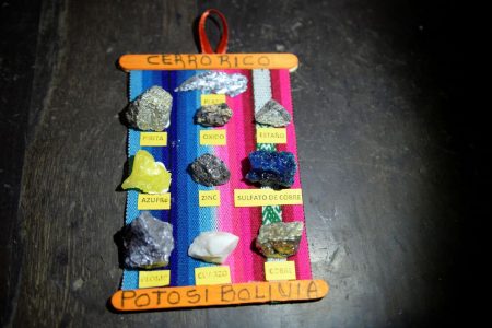 A display shows samples of various minerals from Cerro Rico, an active silver mine that is slowly sinking and collapsing onto itself, in Potosi, Bolivia March 24, 2022. REUTERS/Claudia Morales