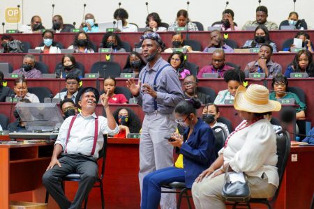 A skit that looked at the evolution of the media was part of the ‘Journalism Under Surveillance” conference which was hosted by the Government of Guyana yesterday at the Arthur Chung Conference Centre. The performers from left were Paul Budhna, Mark Luke Edwards,  Sophira Abraham Williams and Simone Dowding. (Office of the President photo)