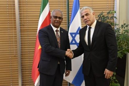 Suriname's Foreign Minister Albert Ramdin is hosted by Foreign Minister Yair Lapid in Jerusalem on May 30, 2022 (Jorge Novomisky/GPO)