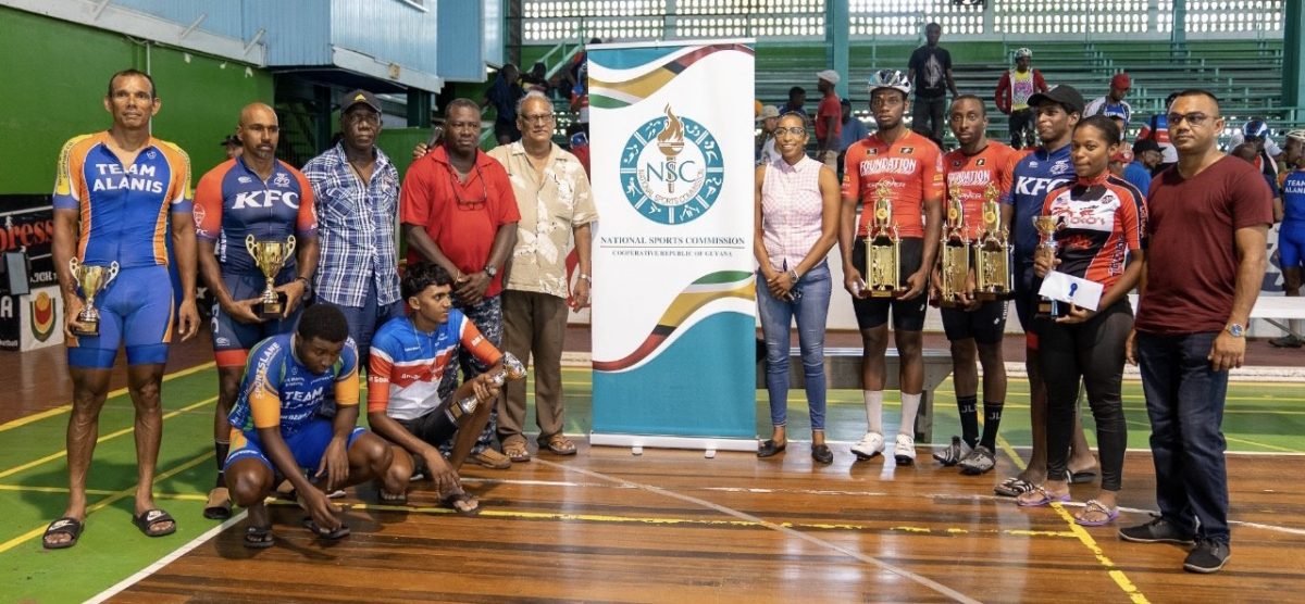 The principals and the top prize winners of the 39th edition of the Independence Three-Stage road race pose for a photo following the award ceremony yesterday at the Cliff Anderson Sports Hall.