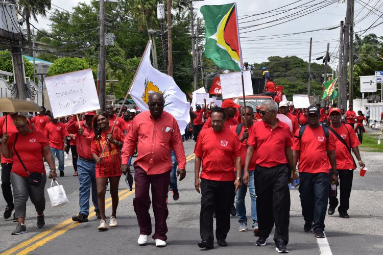 FITUG executive Carvil Duncan (left in front row) and Seepaul Narine (centre in front row)
leading the May Day March along Main Street, Georgetown yesterday. (GAWU photo)
