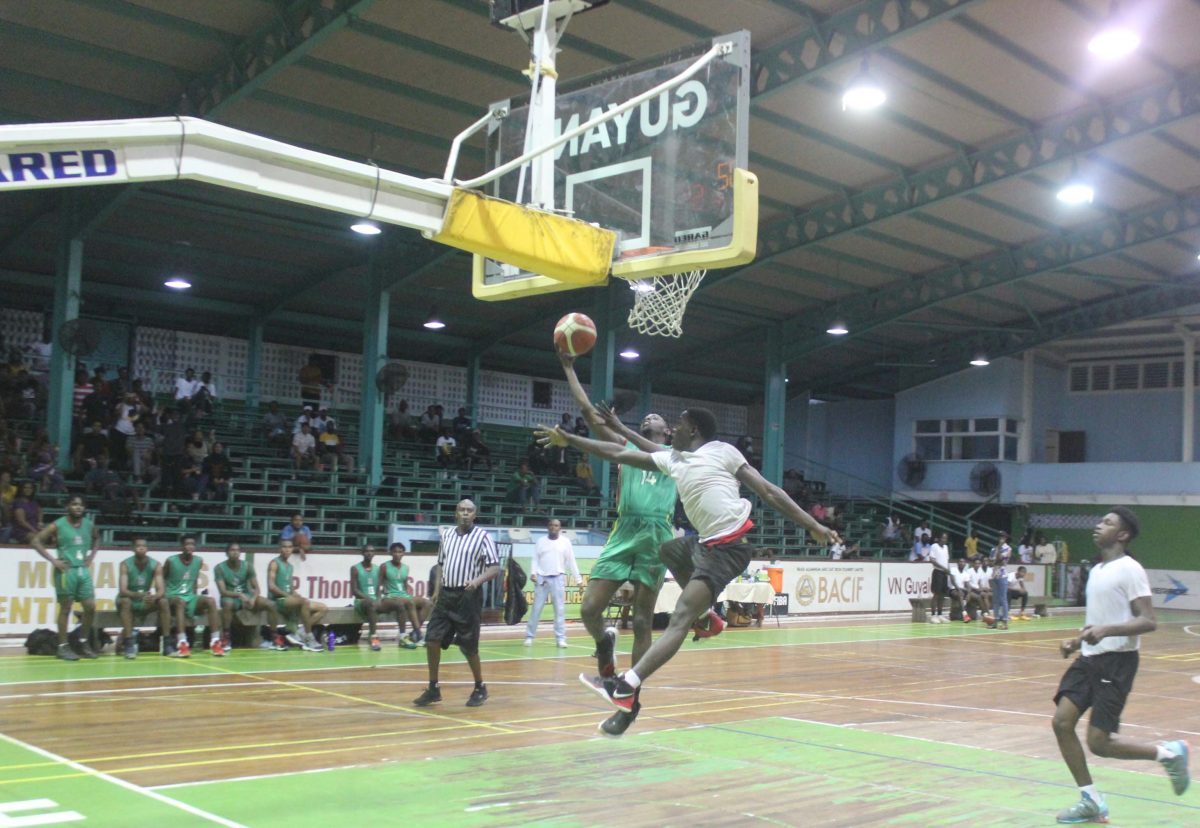 Scenes from the UG and NATI clash in the YBG Tertiary/University League at the Cliff Anderson Sports Hall, Homestretch Avenue