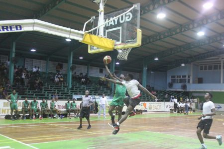 Scenes from the UG and NATI clash in the YBG Tertiary/University League at the Cliff Anderson Sports Hall, Homestretch Avenue
