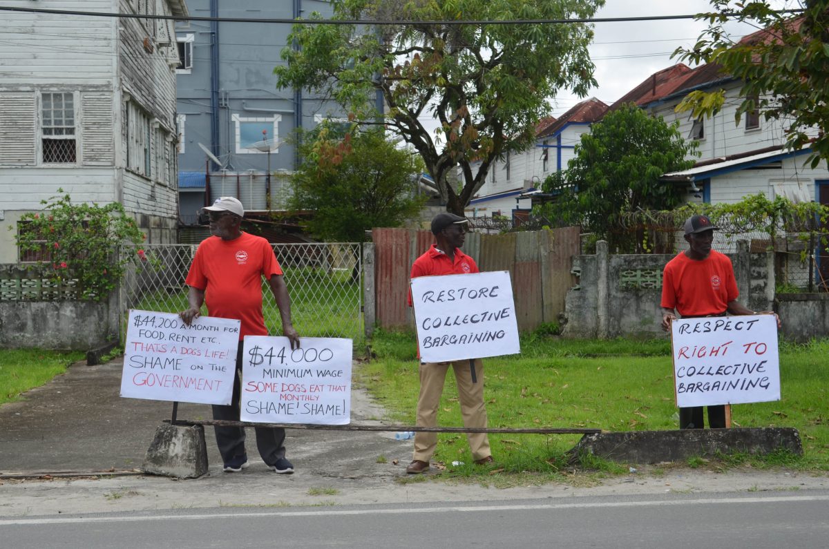 Protestors outside the Ministry of Labour on Brickdam on Friday  (Orlando Charles photo)