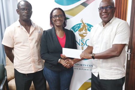 Director of Sport Steve Ninvalle makes the NSC’s presentation to GDA representatives for the inaugural Faye Joseph Memorial Dominoes tournament