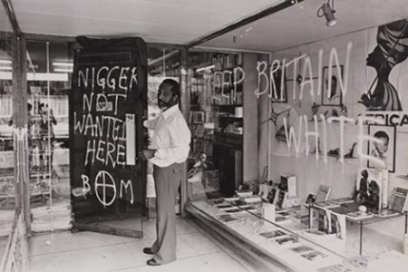 Eric Huntley outside the Bogle L’Ouverture’s Bookshop following one of the many racist attacks
