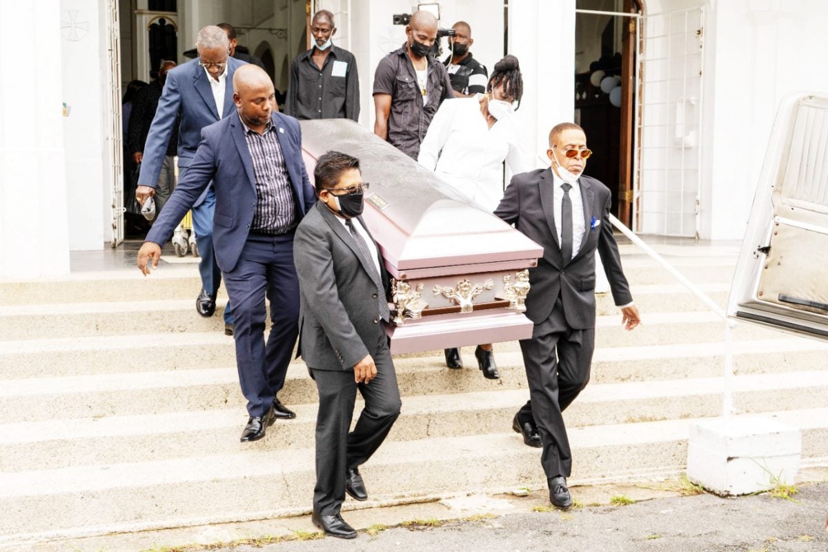 Senior Minister in the Office of the President with responsibility for finance Dr Ashni Singh (at left in foreground), hailed the contributions of the late Queen’s College Deputy Headmistress Esther Rawlins at her funeral service last Thursday (Ministry of Finance photo)