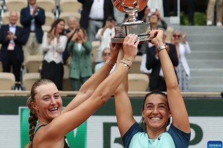 Caroline Garcia (right) and Kristina Mladenovic, are all smiles after winning the French Open women’s doubles title