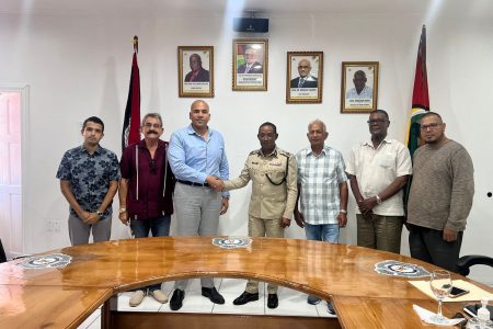 Commissioner of Police (ag), Clifton Hicken on Friday met officials from the Guyana Gold and Diamond Miners Association (GGDMA) with the aim of resuscitating the hinterland intelligence community meeting in order to enhance the security posture within the hinterland regions. The meeting was held in the Commissioners’ conference room, Eve Leary. In a press release, the Guyana Police Force said during the meeting there was a “shared” vision in terms of areas where the GPF and the GGDMA can complement each other to mitigate crime and violence. The team from GGDMA was headed by its President Andron Alphonso. Among the executive members who were present were Charles Da Silva, Azeem Baksh, Patrick Harding, Geraldo Alphonso and Avalon Jagnandan. In photo, Acting Commissioner of Police Clifton Hicken (at centre) in a handshake with President of the GGDMA, Andron Alphonso (third, from left) and other executive members of the GGDMA yesterday. (Guyana Police Force photo)