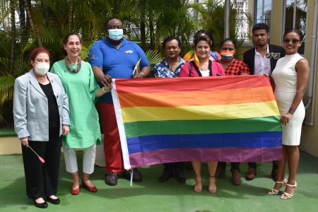Minister of Parliamentary Affairs and Governance Gail Teixeira, UN Resident Coordinator, Yeşim Oruç and representatives of Guyana Trans United, the Guyana Rainbow Foundation, EQUAL Guyana, Proud To Be Trans, and Tamùkke Feminists on Friday at UN House, where the United Nations in Guyana held a flag raising ceremony to mark the launch of Pride Month. In a statement, UN Guyana said the rights of lesbian, gay, bisexual, transgender, intersex, and queer (LGBTIQ+) persons are human rights and are protected by international law. It quoted Oruç as saying, “UN agencies have a history of working together with LGBTIQ+ organisations to address the challenges and vulnerabilities that LGBTIQ+ communities face and to ensure that they are not left behind from Guyana’s enormous development potential.” Teixeira, meanwhile, added that “the government is committed to human rights and democracy…this is an issue that we will continue to strive to make progress on.” (UN Guyana photo) 