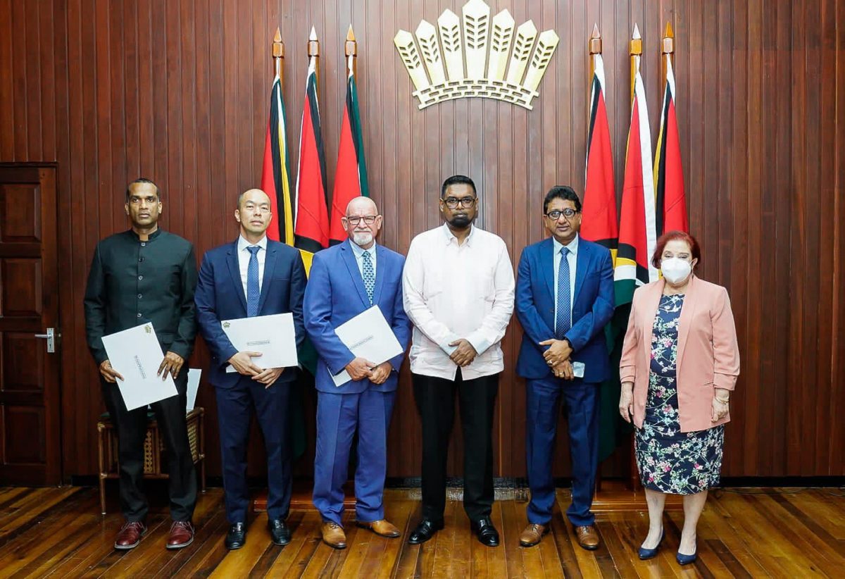 President Irfaan Ali (third from right) with the new members of the Police Service Commission and Attorney General Anil Nandlall and Governance Minister Gail Teixeira (Office of the President photo)