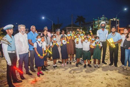 Ambassador of the European Union, Fernando Ponz Canto (second from left) and other officials posed with a group of schoolchildren as they displayed the armbands.